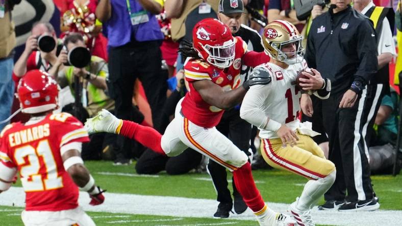 Feb 11, 2024; Paradise, Nevada, USA; San Francisco 49ers quarterback Brock Purdy (13) is tackled by Kansas City Chiefs linebacker Nick Bolton (32) in the first half in Super Bowl LVIII at Allegiant Stadium. Mandatory Credit: Stephen R. Sylvanie-USA TODAY Sports