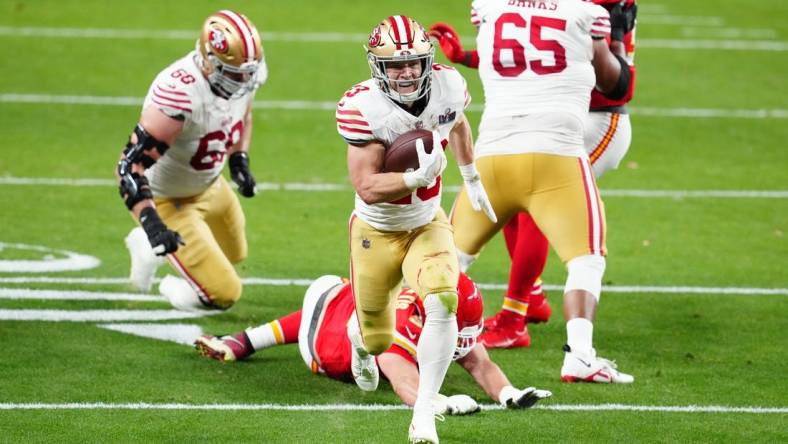 Feb 11, 2024; Paradise, Nevada, USA; San Francisco 49ers running back Christian McCaffrey (23) scores a touchdown against the Kansas City Chiefs in the first half in Super Bowl LVIII at Allegiant Stadium. Mandatory Credit: Stephen R. Sylvanie-USA TODAY Sports