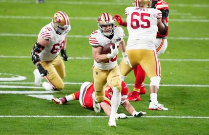 Feb 11, 2024; Paradise, Nevada, USA; San Francisco 49ers running back Christian McCaffrey (23) scores a touchdown against the Kansas City Chiefs in the first half in Super Bowl LVIII at Allegiant Stadium. Mandatory Credit: Stephen R. Sylvanie-USA TODAY Sports