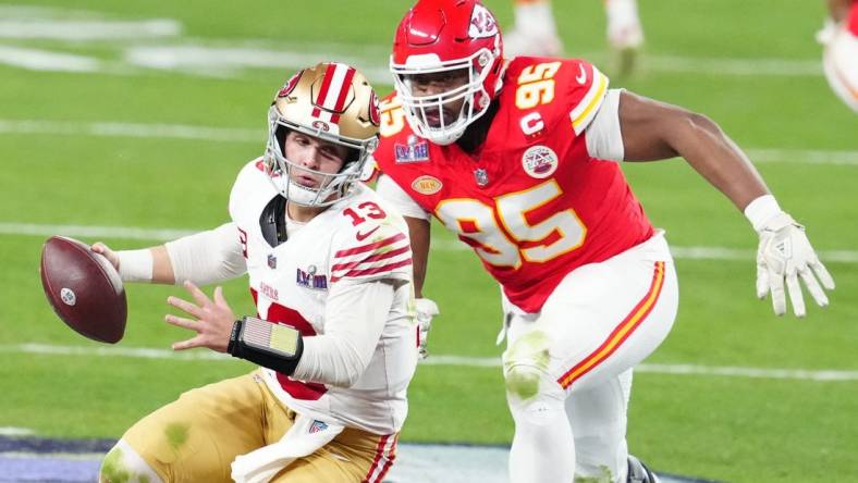 Feb 11, 2024; Paradise, Nevada, USA; San Francisco 49ers quarterback Brock Purdy (13) is pressured by Kansas City Chiefs defensive tackle Chris Jones (95) in the second half in Super Bowl LVIII at Allegiant Stadium. Mandatory Credit: Stephen R. Sylvanie-USA TODAY Sports