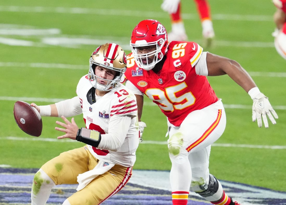 Feb 11, 2024; Paradise, Nevada, USA; San Francisco 49ers quarterback Brock Purdy (13) is pressured by Kansas City Chiefs defensive tackle Chris Jones (95) in the second half in Super Bowl LVIII at Allegiant Stadium. Mandatory Credit: Stephen R. Sylvanie-USA TODAY Sports