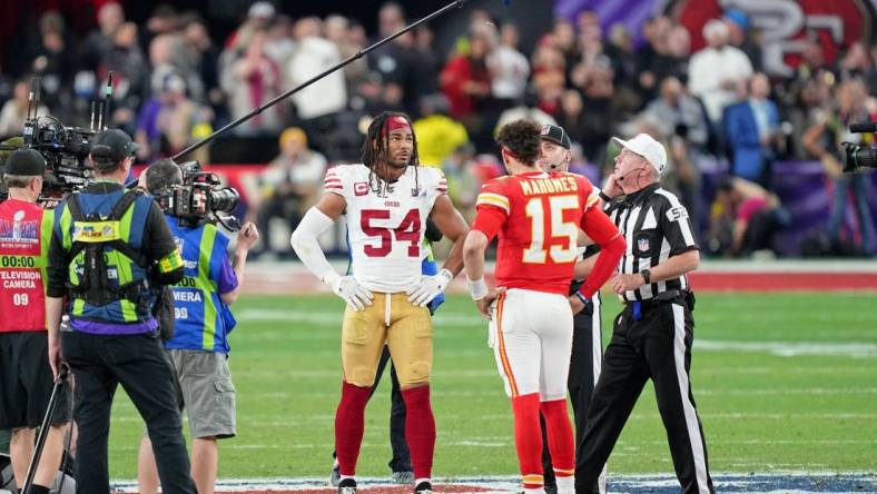 Feb 11, 2024; Paradise, Nevada, USA; San Francisco 49ers linebacker Fred Warner (54) and Kansas City Chiefs quarterback Patrick Mahomes (15) during the coin toss before overtime of Super Bowl LVIII at Allegiant Stadium. Mandatory Credit: Kyle Terada-USA TODAY Sports