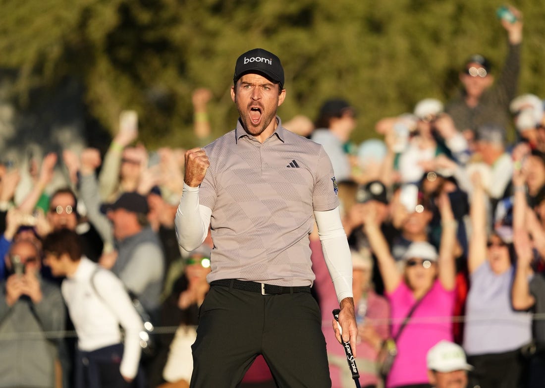 Feb 11, 2024; Scottsdale, AZ, USA; Nick Taylor reacts after making his birdie putt to force a playoff with Charley Hoffman
on the 18th hole during the final round of the WM Phoenix Open at TPC Scottsdale. Mandatory Credit: Rob Schumacher-Arizona Republic