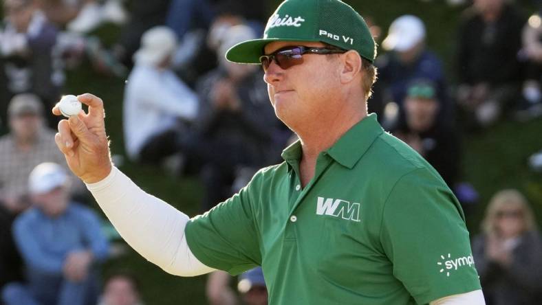 Feb 11, 2024; Scottsdale, AZ, USA; Charley Hoffman finishes with in the lead on the 18th hole during the final round of the WM Phoenix Open at TPC Scottsdale. Mandatory Credit: Rob Schumacher-Arizona Republic