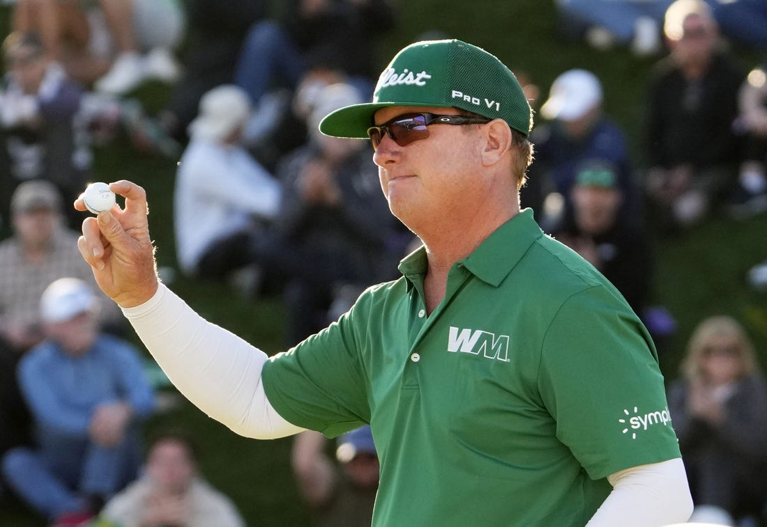 Feb 11, 2024; Scottsdale, AZ, USA; Charley Hoffman finishes with in the lead on the 18th hole during the final round of the WM Phoenix Open at TPC Scottsdale. Mandatory Credit: Rob Schumacher-Arizona Republic