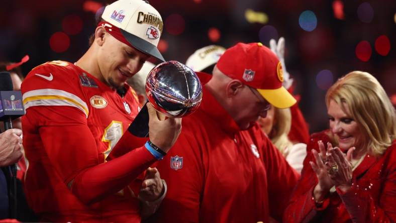 Feb 11, 2024; Paradise, Nevada, USA; Kansas City Chiefs quarterback Patrick Mahomes (15) celebrates with the Vince Lombardi Trophy after defeating the San Francisco 49ers in Super Bowl LVIII at Allegiant Stadium. Mandatory Credit: Mark J. Rebilas-USA TODAY Sports