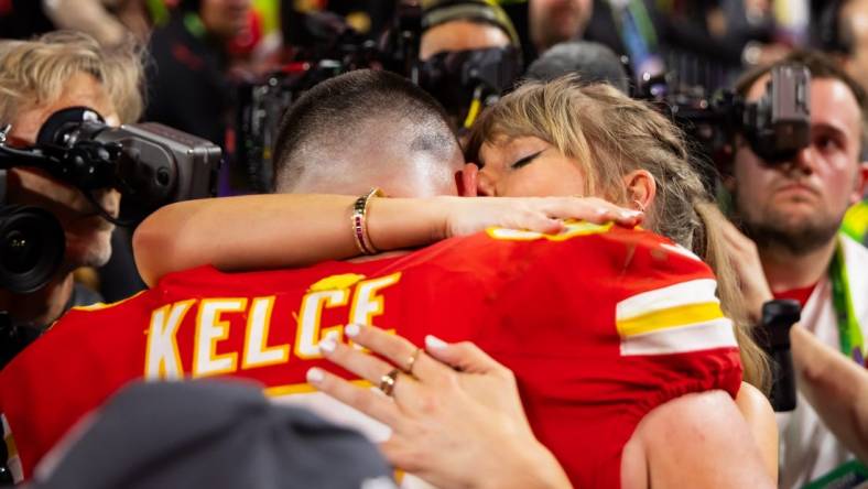 Feb 11, 2024; Paradise, Nevada, USA; Kansas City Chiefs tight end Travis Kelce (87) celebrates with girlfriend Taylor Swift after defeating the San Francisco 49ers in Super Bowl LVIII at Allegiant Stadium. Mandatory Credit: Mark J. Rebilas-USA TODAY Sports