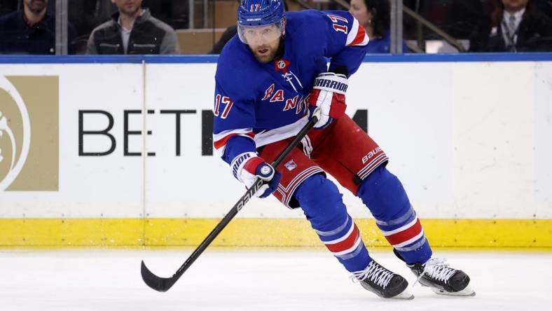 Feb 12, 2024; New York, New York, USA; New York Rangers right wing Blake Wheeler (17) skates with the puck against the Calgary Flames during the first period at Madison Square Garden. Mandatory Credit: Brad Penner-USA TODAY Sports