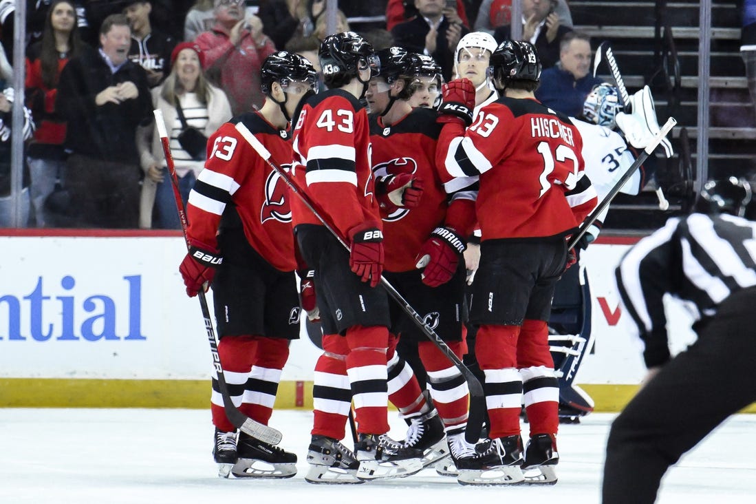 Feb 12, 2024; Newark, New Jersey, USA; New Jersey Devils right wing Tyler Toffoli (73) celebrates with teammates after scoring a goal against the Seattle Kraken during the first period at Prudential Center. Mandatory Credit: John Jones-USA TODAY Sports