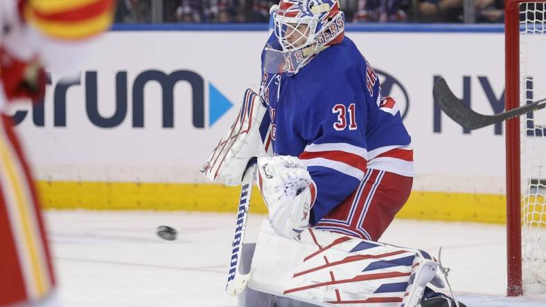Feb 12, 2024; New York, New York, USA; New York Rangers goaltender Igor Shesterkin (31) makes a save against the Calgary Flames during the second period at Madison Square Garden. Mandatory Credit: Brad Penner-USA TODAY Sports