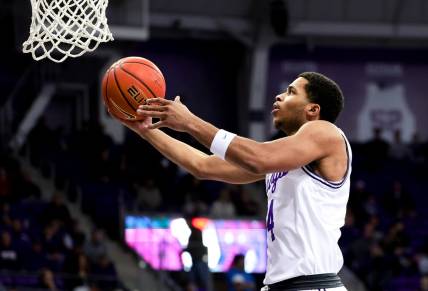 Feb 12, 2024; Fort Worth, Texas, USA;  TCU Horned Frogs guard Jameer Nelson Jr. (4) shoots during the first half against the West Virginia Mountaineers at Ed and Rae Schollmaier Arena. Mandatory Credit: Kevin Jairaj-USA TODAY Sports