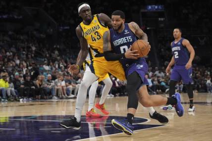 Feb 12, 2024; Charlotte, North Carolina, USA; Charlotte Hornets forward Miles Bridges (0) drives to the basket guarded by Indiana Pacers forward Pascal Siakam (43) during the second half at Spectrum Center. Mandatory Credit: Jim Dedmon-USA TODAY Sports