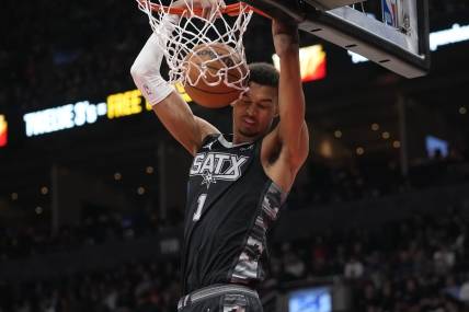 Feb 12, 2024; Toronto, Ontario, CAN; San Antonio Spurs center Victor Wembanyama (1) dunks the ball against the Toronto Raptors during the second half at Scotiabank Arena. Mandatory Credit: John E. Sokolowski-USA TODAY Sports