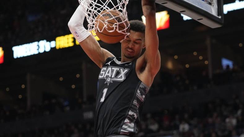 Feb 12, 2024; Toronto, Ontario, CAN; San Antonio Spurs center Victor Wembanyama (1) dunks the ball against the Toronto Raptors during the second half at Scotiabank Arena. Mandatory Credit: John E. Sokolowski-USA TODAY Sports