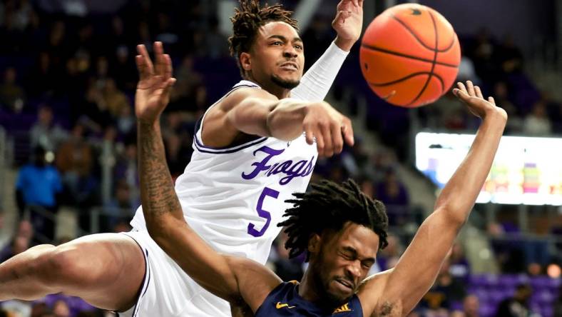 Feb 12, 2024; Fort Worth, Texas, USA;  TCU Horned Frogs forward Chuck O'Bannon Jr. (5) defends the shot of West Virginia Mountaineers guard Jeremiah Bembry (5) during the second half at Ed and Rae Schollmaier Arena. Mandatory Credit: Kevin Jairaj-USA TODAY Sports