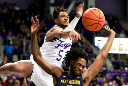 Feb 12, 2024; Fort Worth, Texas, USA;  TCU Horned Frogs forward Chuck O'Bannon Jr. (5) defends the shot of West Virginia Mountaineers guard Jeremiah Bembry (5) during the second half at Ed and Rae Schollmaier Arena. Mandatory Credit: Kevin Jairaj-USA TODAY Sports
