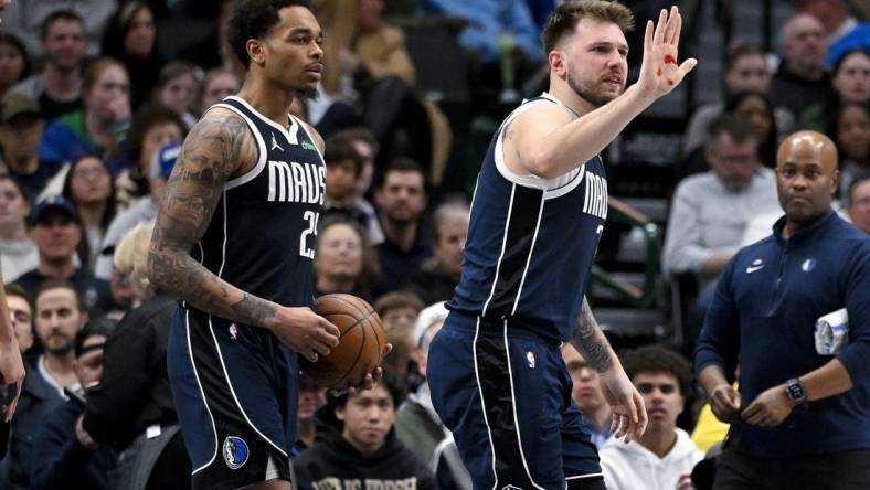 Feb 12, 2024; Dallas, Texas, USA; Dallas Mavericks guard Luka Doncic (77) shows blood on his hand after he is hit in the face by Washington Wizards forward Corey Kispert (not pictured) during the second half at the American Airlines Center. Mandatory Credit: Jerome Miron-USA TODAY Sports