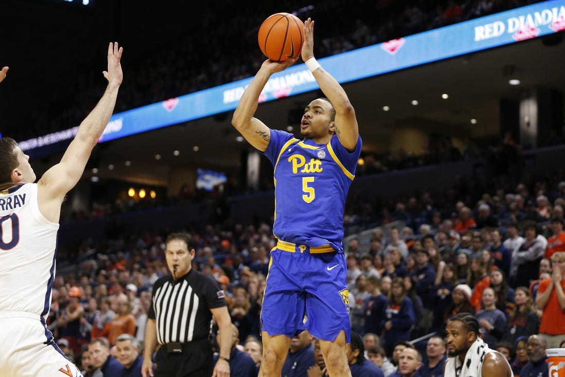 Feb 13, 2024; Charlottesville, Virginia, USA; Pittsburgh Panthers guard Ishmael Leggett (5) shoots the ball over Virginia Cavaliers guard Taine Murray (10) during the first half at John Paul Jones Arena. Mandatory Credit: Amber Searls-USA TODAY Sports