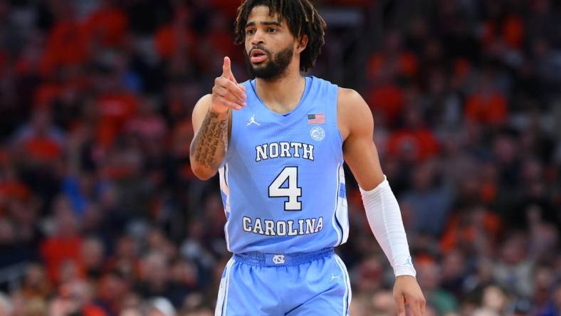 Feb 13, 2024; Syracuse, New York, USA; North Carolina Tar Heels guard RJ Davis (4) reacts to a play against the Syracuse Orange during the first half at the JMA Wireless Dome. Mandatory Credit: Rich Barnes-USA TODAY Sports