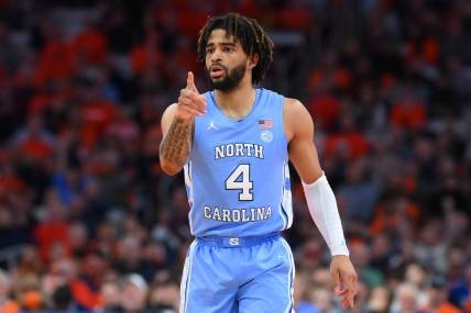 Feb 13, 2024; Syracuse, New York, USA; North Carolina Tar Heels guard RJ Davis (4) reacts to a play against the Syracuse Orange during the first half at the JMA Wireless Dome. Mandatory Credit: Rich Barnes-USA TODAY Sports