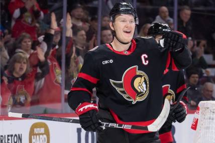 Feb 13, 2024; Ottawa, Ontario, CAN; Ottawa Senators left wing Brady Tkachuk (7) celebrates his goal scored in the first period against the Columbus Blue Jackets at the Canadian Tire Centre. Mandatory Credit: Marc DesRosiers-USA TODAY Sports