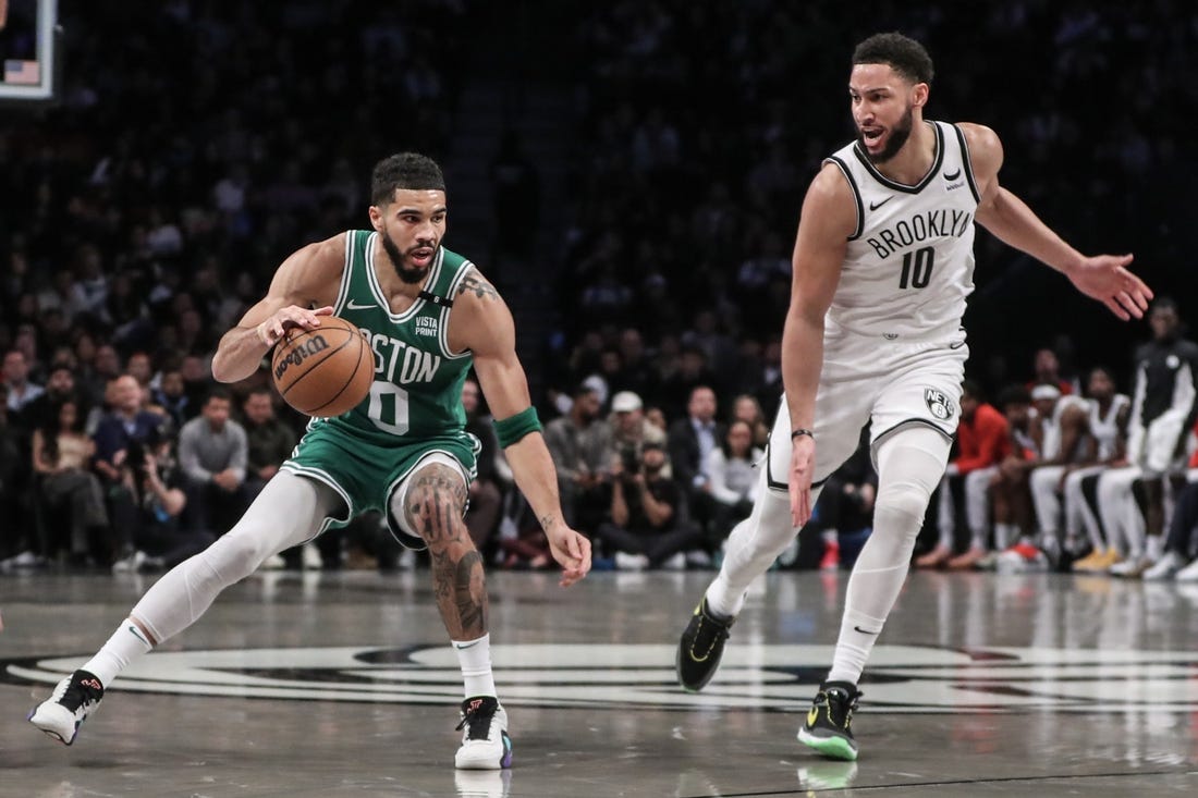 Feb 13, 2024; Brooklyn, New York, USA;  Boston Celtics forward Jayson Tatum (0) looks to drive past Brooklyn Nets guard Ben Simmons (10) in the second quarter at Barclays Center. Mandatory Credit: Wendell Cruz-USA TODAY Sports