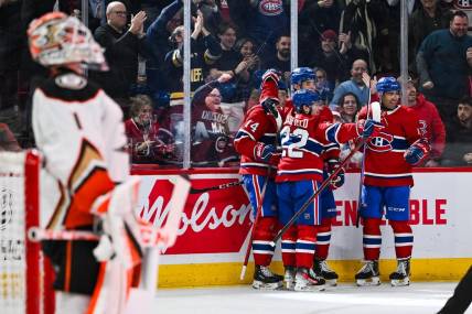 Feb 13, 2024; Montreal, Quebec, CAN; Montreal Canadiens center Nick Suzuki (14) celebrates his first goal of the game against the Anaheim Ducks with his teammates during the second period at Bell Centre. Mandatory Credit: David Kirouac-USA TODAY Sports