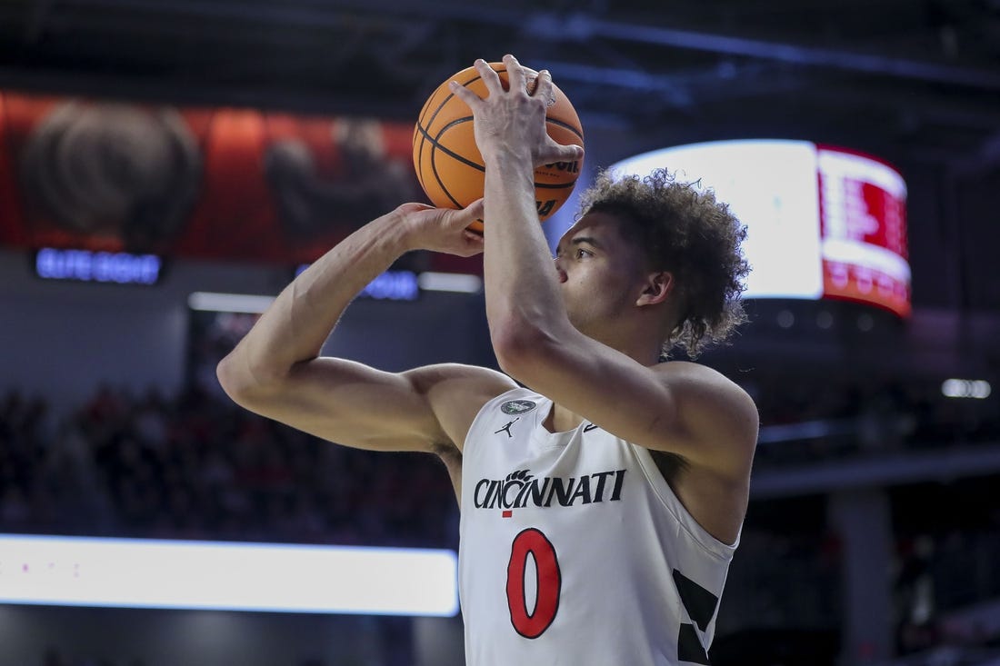 Feb 13, 2024; Cincinnati, Ohio, USA; Cincinnati Bearcats guard Dan Skillings Jr. (0) shoots against the Iowa State Cyclones in the second half at Fifth Third Arena. Mandatory Credit: Katie Stratman-USA TODAY Sports