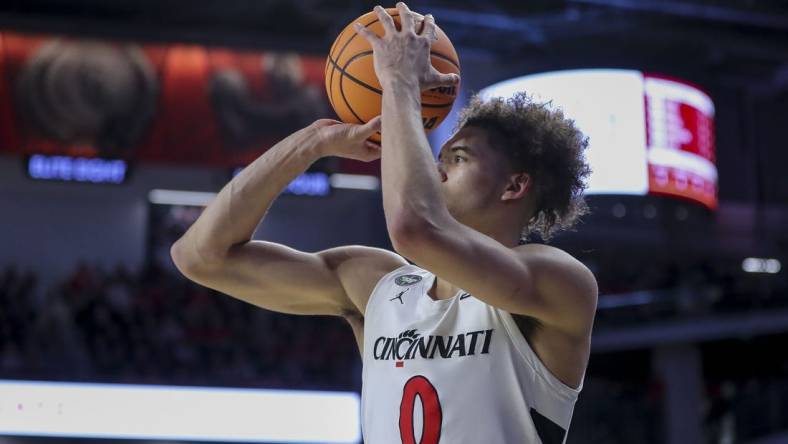 Feb 13, 2024; Cincinnati, Ohio, USA; Cincinnati Bearcats guard Dan Skillings Jr. (0) shoots against the Iowa State Cyclones in the second half at Fifth Third Arena. Mandatory Credit: Katie Stratman-USA TODAY Sports