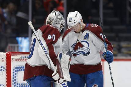 Feb 13, 2024; Washington, District of Columbia, USA; Colorado Avalanche goaltender Alexandar Georgiev (40) celebrates wth Avalanche center Nathan MacKinnon (29) after their game against the Washington Capitals at Capital One Arena. Mandatory Credit: Geoff Burke-USA TODAY Sports