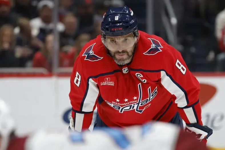 Feb 13, 2024; Washington, District of Columbia, USA; Washington Capitals left wing Alex Ovechkin (8) lines up for a face-off against the Colorado Avalanche in the third period at Capital One Arena. Mandatory Credit: Geoff Burke-USA TODAY Sports