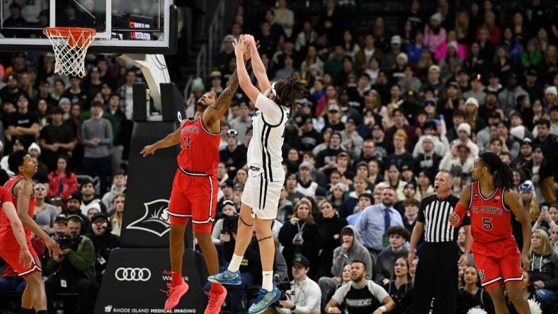 Feb 13, 2024; Providence, Rhode Island, USA; St. John's Red Storm center Joel Soriano (11) defends against Providence Friars forward Josh Oduro (13) during the second half at Amica Mutual Pavilion. Mandatory Credit: Eric Canha-USA TODAY Sports