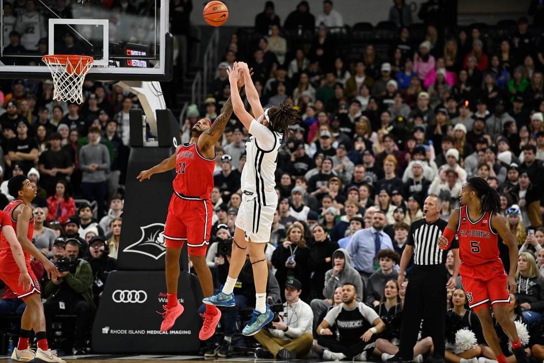 Feb 13, 2024; Providence, Rhode Island, USA; St. John's Red Storm center Joel Soriano (11) defends against Providence Friars forward Josh Oduro (13) during the second half at Amica Mutual Pavilion. Mandatory Credit: Eric Canha-USA TODAY Sports