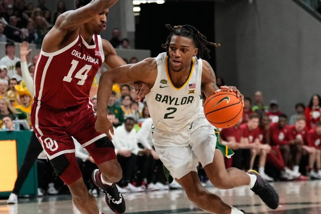 Feb 13, 2024; Waco, Texas, USA;  Baylor Bears guard Jayden Nunn (2) drives to the basket against Oklahoma Sooners forward Jalon Moore (14) during the second half at Paul and Alejandra Foster Pavilion. Mandatory Credit: Chris Jones-USA TODAY Sports