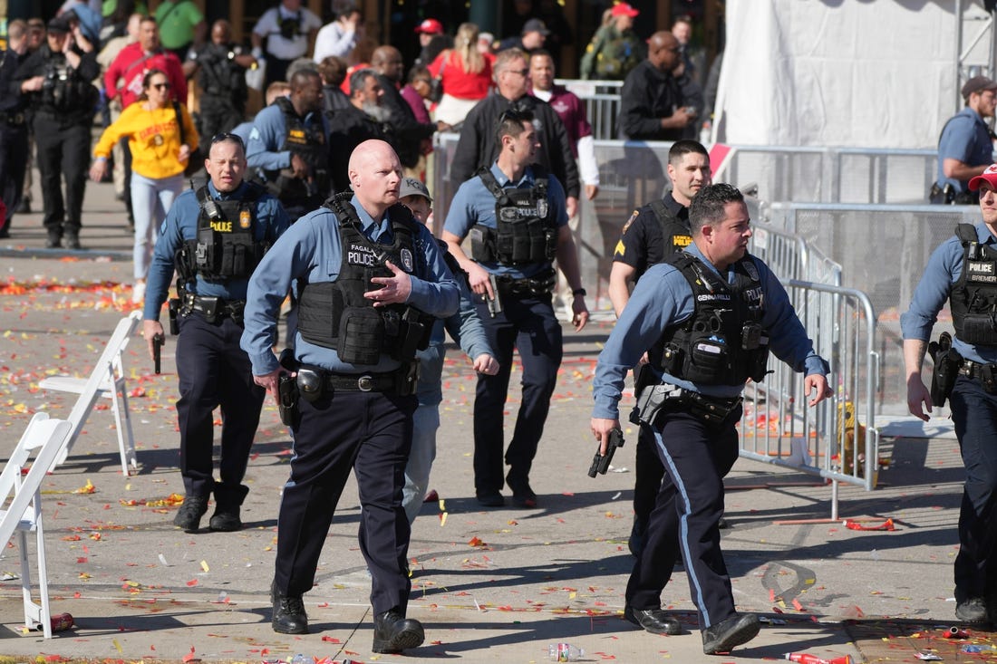 Feb 14, 2024; Kansas City, MO, USA; Police respond after gun shots were fired after the celebration of the Kansas City Chiefs winning Super Bowl LVIII. Mandatory Credit: Kirby Lee-USA TODAY Sports