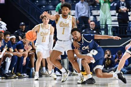 Feb 14, 2024; South Bend, Indiana, USA; Georgia Tech Yellow Jackets guard Kyle Sturdivant (1) knocks the ball away from Notre Dame Fighting Irish guard Julian Roper II (1) in the first half at the Purcell Pavilion. Mandatory Credit: Matt Cashore-USA TODAY Sports