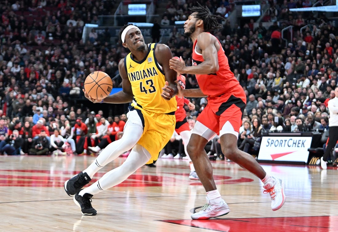 Feb 14, 2024; Toronto, Ontario, CAN;  Indiana Pacers forward Pascal Siakam (43) drives to the basket against Toronto Raptors guard Immanuel Quickley (5) in the first half at Scotiabank Arena. Mandatory Credit: Dan Hamilton-USA TODAY Sports