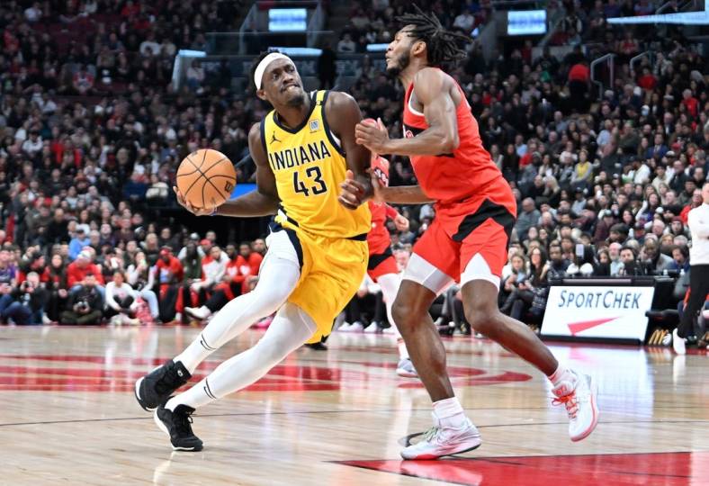 Feb 14, 2024; Toronto, Ontario, CAN; Indiana Pacers forward Pascal Siakam (43) drives to the basket against Toronto Raptors guard Immanuel Quickley (5) in the first half at Scotiabank Arena. Mandatory Credit: Dan Hamilton-USA TODAY Sports