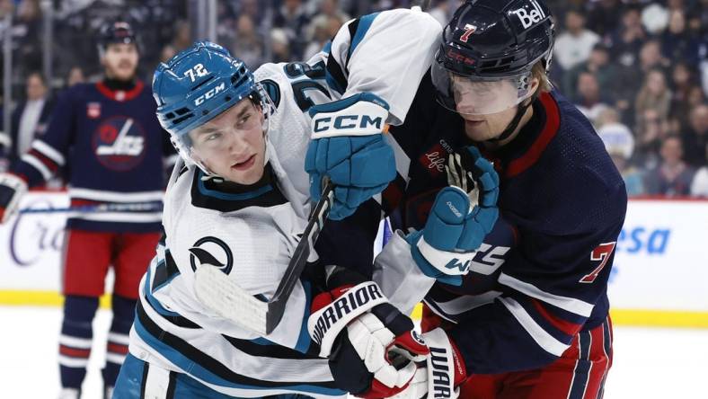 Feb 14, 2024; Winnipeg, Manitoba, CAN; San Jose Sharks left wing William Eklund (72) and Winnipeg Jets center Vladislav Namestnikov (7) tangle up in the second period at Canada Life Centre. Mandatory Credit: James Carey Lauder-USA TODAY Sports