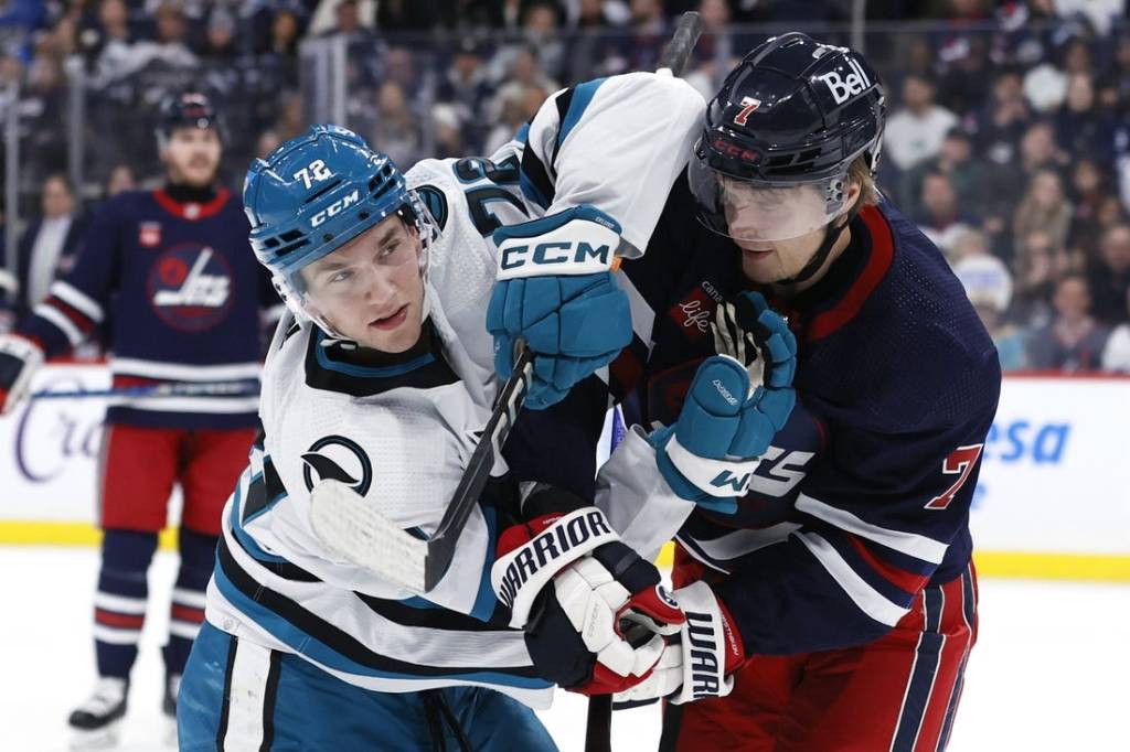 Feb 14, 2024; Winnipeg, Manitoba, CAN; San Jose Sharks left wing William Eklund (72) and Winnipeg Jets center Vladislav Namestnikov (7) tangle up in the second period at Canada Life Centre. Mandatory Credit: James Carey Lauder-USA TODAY Sports