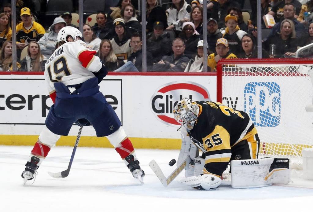 Feb 14, 2024; Pittsburgh, Pennsylvania, USA; Pittsburgh Penguins goaltender Tristan Jarry (35) makes a save against Florida Panthers left wing Matthew Tkachuk (19) during the second period at PPG Paints Arena. Mandatory Credit: Charles LeClaire-USA TODAY Sports