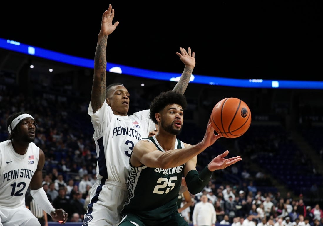 Feb 14, 2024; University Park, Pennsylvania, USA; Michigan State Spartans forward Malik Hall (25) passes the ball as Penn State Nittany Lions guard Nick Kern Jr (3) defends during the second half at Bryce Jordan Center. Michigan State defeated Penn State 80-72. Mandatory Credit: Matthew O'Haren-USA TODAY Sports