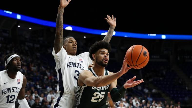 Feb 14, 2024; University Park, Pennsylvania, USA; Michigan State Spartans forward Malik Hall (25) passes the ball as Penn State Nittany Lions guard Nick Kern Jr (3) defends during the second half at Bryce Jordan Center. Michigan State defeated Penn State 80-72. Mandatory Credit: Matthew O'Haren-USA TODAY Sports