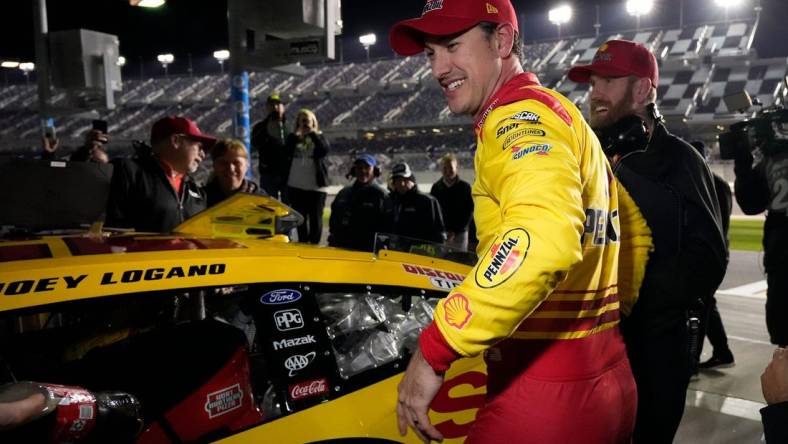 Joey Logano is all smiles after winning the pole for the Daytona 500 during pole qualifying at Daytona International Speedway, Wednesday, Feb. 14, 2024.