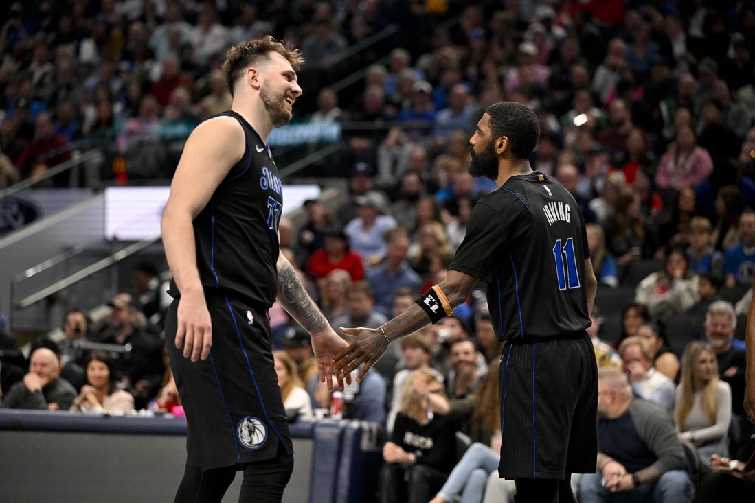 Feb 14, 2024; Dallas, Texas, USA; Dallas Mavericks guard Luka Doncic (77) and guard Kyrie Irving (11) celebrate during the second half against the San Antonio Spurs at the American Airlines Center. Mandatory Credit: Jerome Miron-USA TODAY Sports