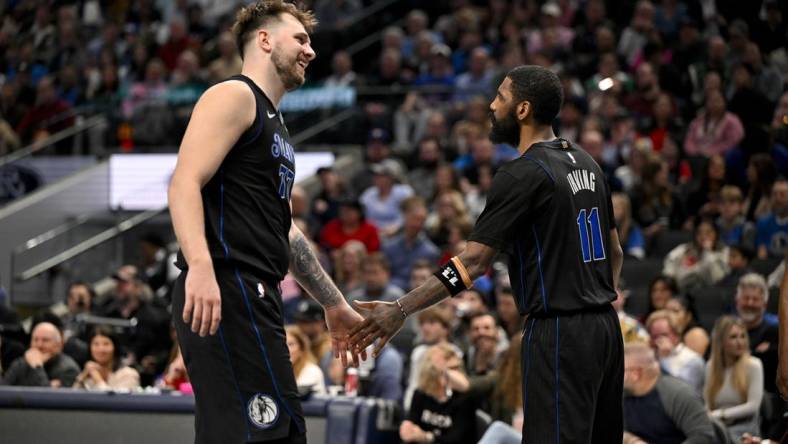 Feb 14, 2024; Dallas, Texas, USA; Dallas Mavericks guard Luka Doncic (77) and guard Kyrie Irving (11) celebrate during the second half against the San Antonio Spurs at the American Airlines Center. Mandatory Credit: Jerome Miron-USA TODAY Sports