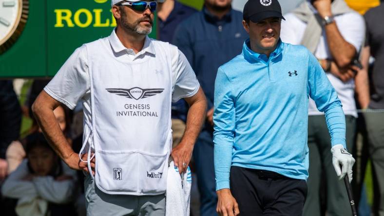 Feb 15, 2024; Pacific Palisades, California, USA; Jordan Spieth and his caddie on the tenth hole during the first round of The Genesis Invitational golf tournament. Mandatory Credit: Jason Parkhurst-USA TODAY Sports