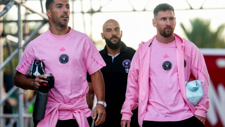 Feb 15, 2024; Fort Lauderdale, FL, USA;  Inter Miami CF forward Lionel Messi (10) and Inter Miami CF forward Luis Suarez (9) arrive for a game against the Newell's Old Boys at DRV PNK Stadium. Mandatory Credit: Nathan Ray Seebeck-USA TODAY Sports