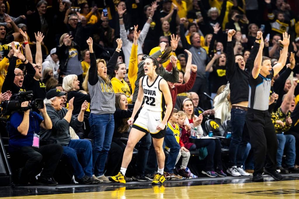 Iowa guard Caitlin Clark (22) reacts after making a 3-point basket setting the record for all-time leading scoring during a NCAA Big Ten Conference women's basketball game against Michigan, Thursday, Feb. 15, 2024, at Carver-Hawkeye Arena in Iowa City, Iowa.