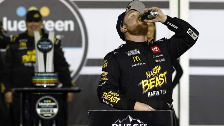 Feb 15, 2024; Daytona Beach, Florida, USA; NASCAR Cup Series driver Tyler Reddick (45) reacts in victory lane after winning the Bluegreen Vacations Duel 1 at Daytona International Speedway. Mandatory Credit: Peter Casey-USA TODAY Sports